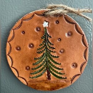 Handmade hand-carved leather Christmas tree magnet with wood backing